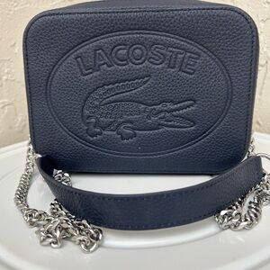 Lacoste Croco Crew small grained leather shoulder bag in blue.